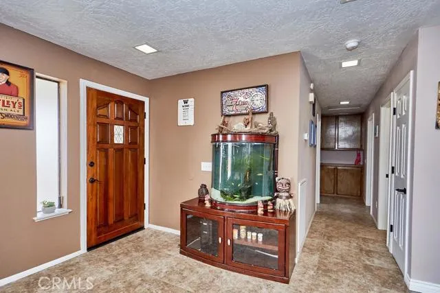Large entry hall has lots of natural light, and tile floors.