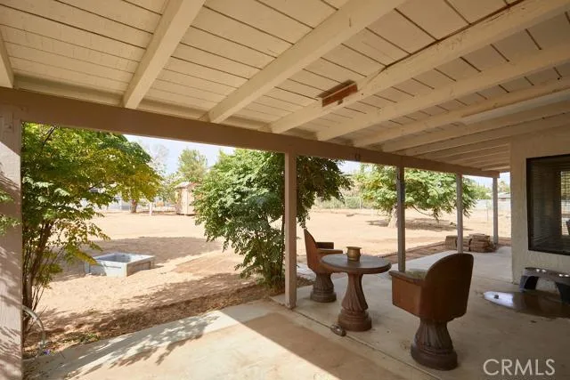 Large covered patio with lighting.