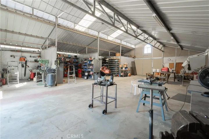 Barn features tack room, feed room and larger room for horse care