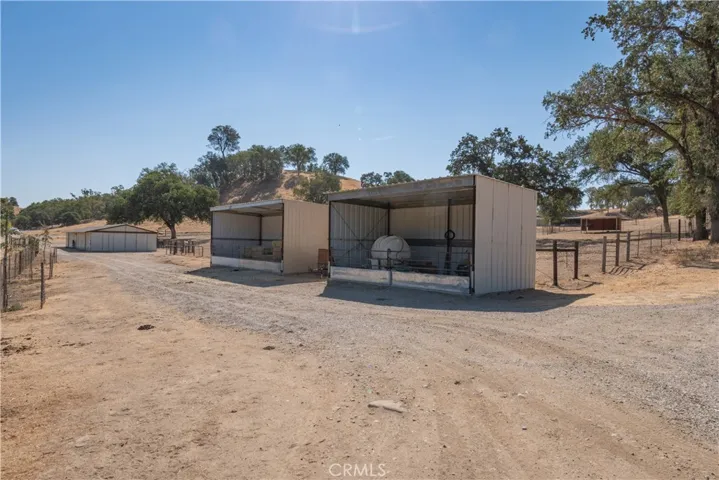 2 hay storage barns are 3 sided