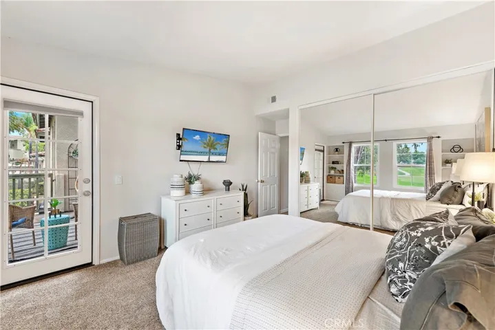 Lovely master bedroom with direct access to balcony. Newer mirrored wardrobe doors.
