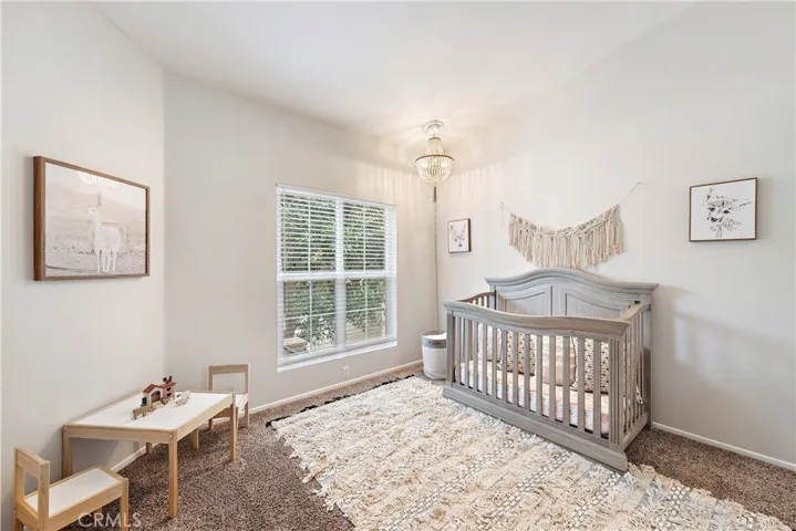 Spacious front bedroom with custom closet system.