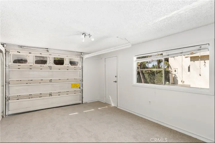 GARAGE WITH NEW CARPET INSTALLED