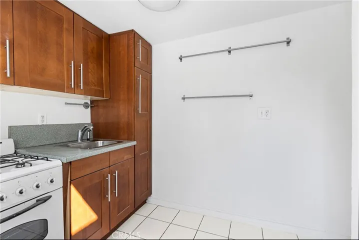 KITCHENETTE/UTILITY CABINET AREA
