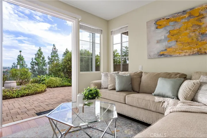 Dramatic views from your sofa in the living room! Oversized patio door that opens to backyard