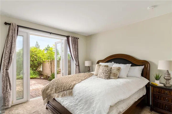 Master with access to large backyard through the stunning french doors