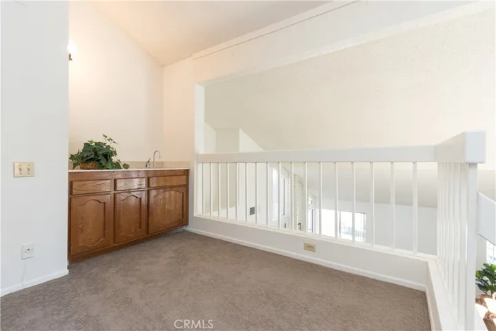 Built in cabinets in loft, overlooking living and dining rooms.