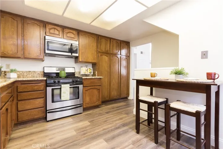 Pantry storage and stainless steel appliances.