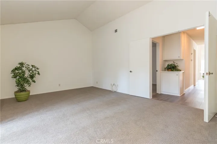 Double door entry to master bedroom, with linen storage in the hall.