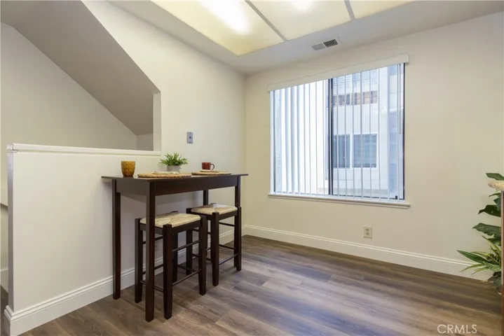 Large window in breakfast area, with stairs to garage and laundry close.