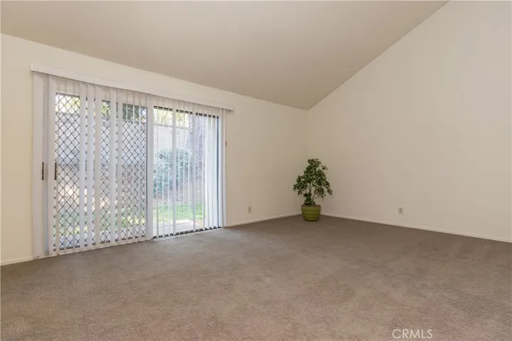 Tranquil master suite has sliding door to backyard slope.