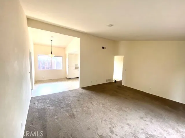Living room opens to eat in kitchen