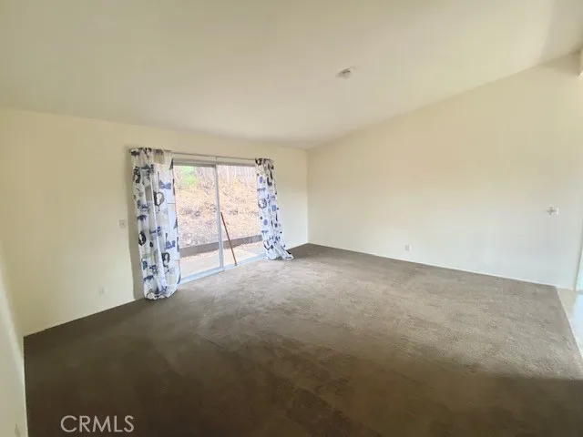 Living room with slider to side yard.