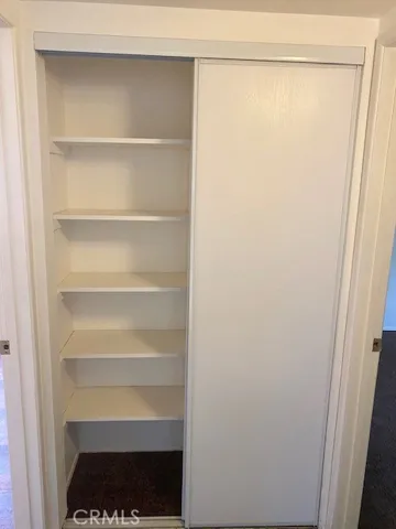 Storage closet at end of hallway.