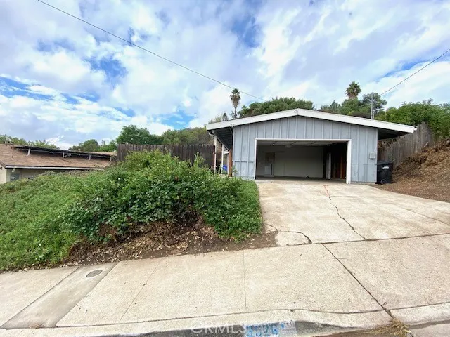 2 car garage with electric roll up garage door.