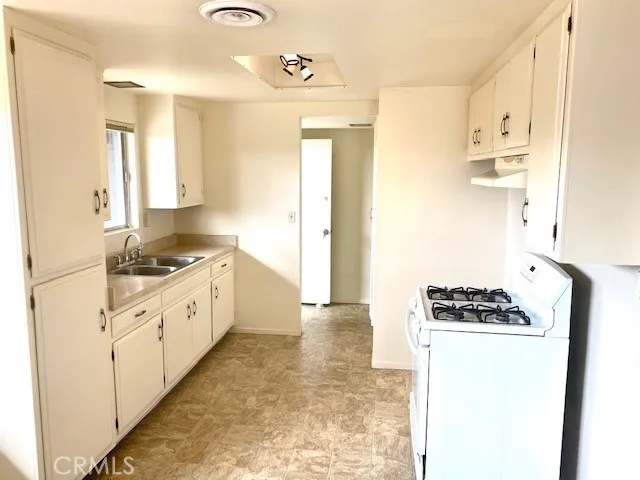Kitchen off of main entrance.