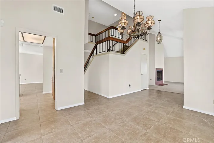 Light and bright dining area open to stairs