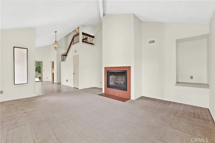 Large corner living room with gas starter fireplace