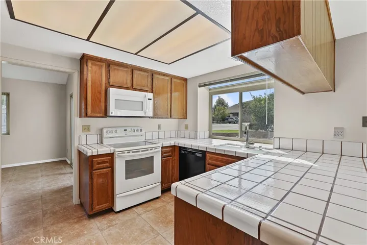 Kitchen with newer range and dishwasher