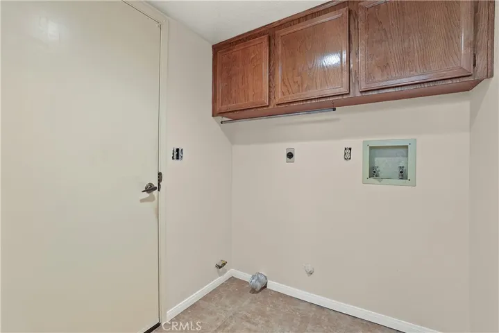 Separate laundry space off garage entrance