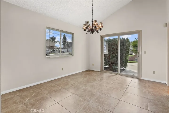 Spacious dining room with newer tile flooring