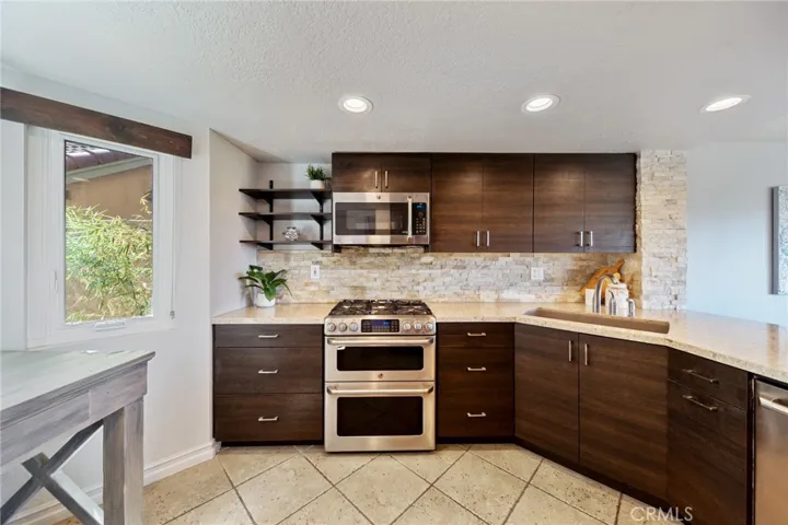 Updated Kitchen Cabinets, Counters and Backsplash