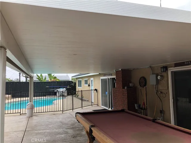 Large covered patio and gated pool