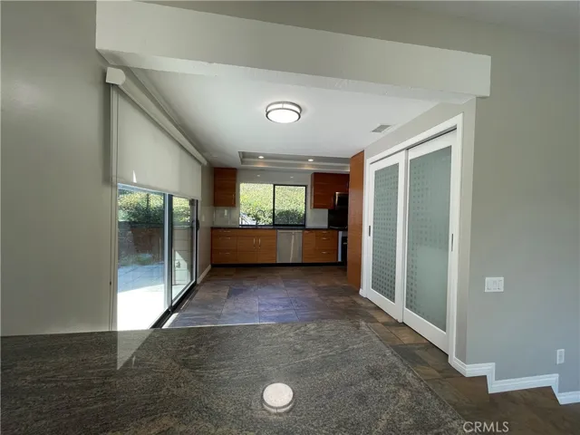Open floor plan. Kitchen opens to the family room and it has a sliding door to the side patio.