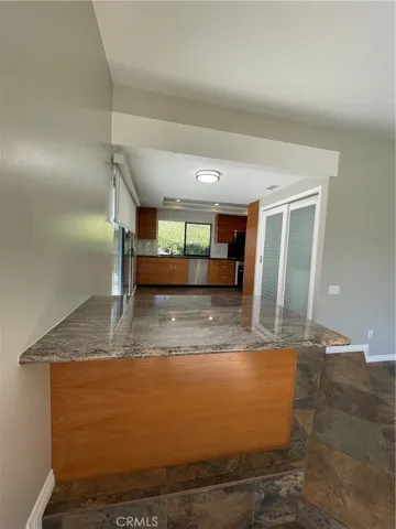 The granite Islands separate the kitchen from the dining room
