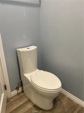 vynal plank flooring in master bathroom.