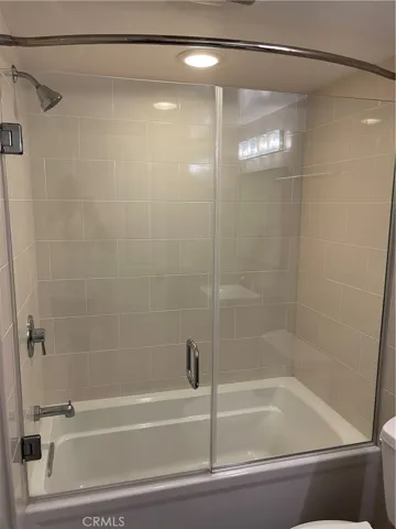 Second bathroom has rain shower in the tube with upgraded Glass shower door. Fully remodeled.