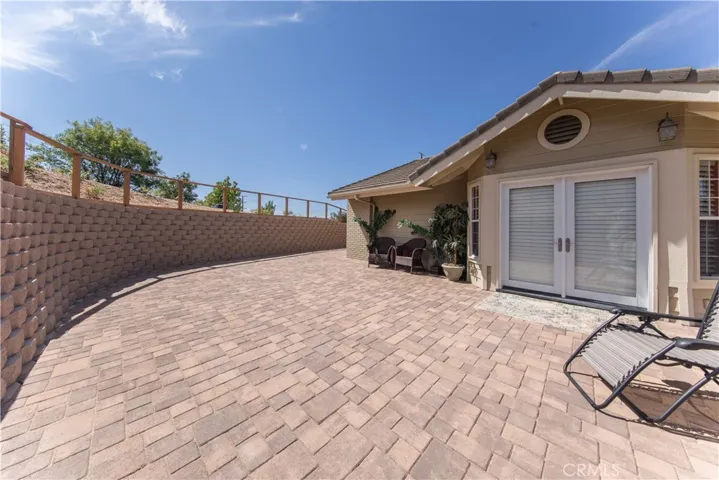 Beautiful side patio off Dining room with pavers