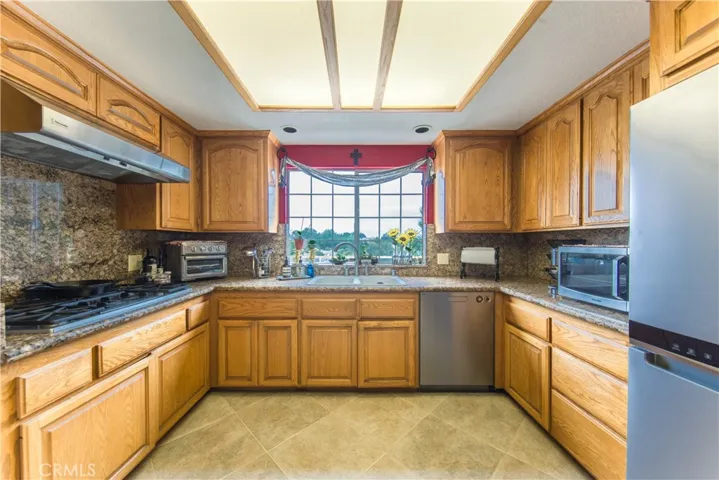 Kitchen with stainless appliances and granite counters