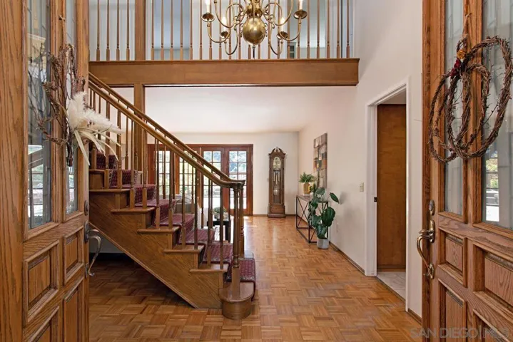 Foyer opening up to formal living room