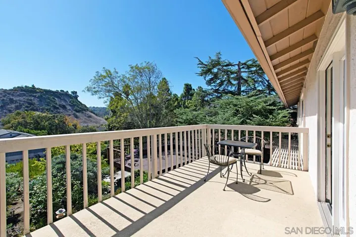 Private balcony off the master bedroom with stairs to the backyard patio.