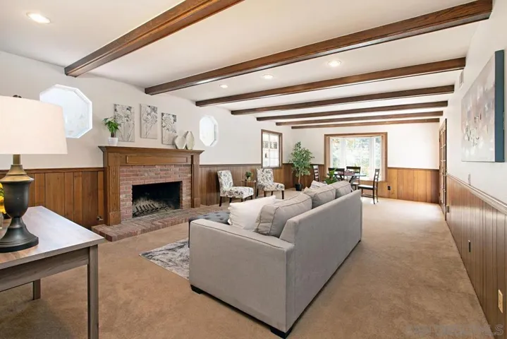 Wood burning fireplace and an extra 10' make this a great room for entertaining or family time