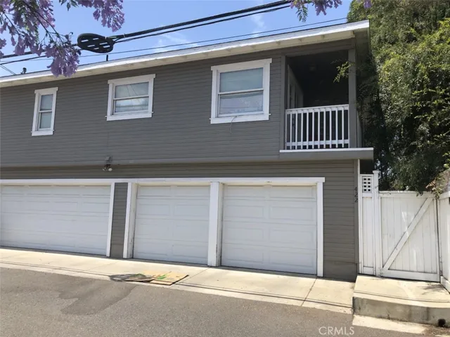 Front of 4-Car Garage and Upstairs Unit