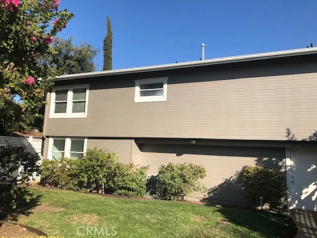 Rear Yard and Back of Garage and Upstairs Unit