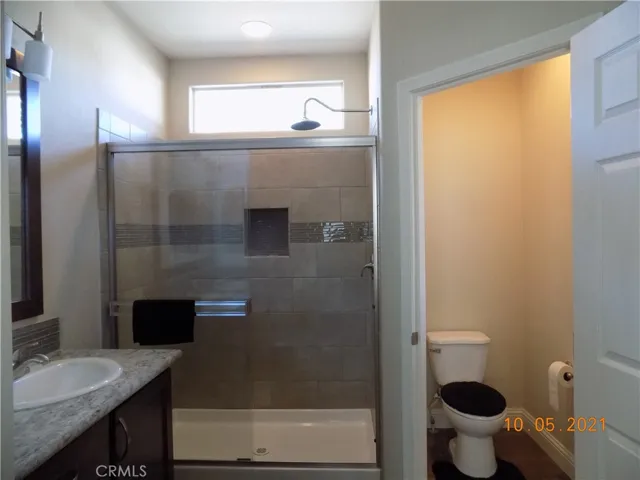 Double sinks, step in shower and water closet in master bathroom