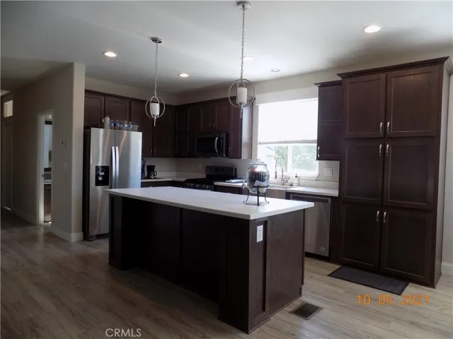 Kitchen is very open with plenty of cupboards and counter space