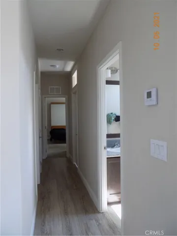 Hallway bath and laundry on the right and 2 guest bedrooms on the left