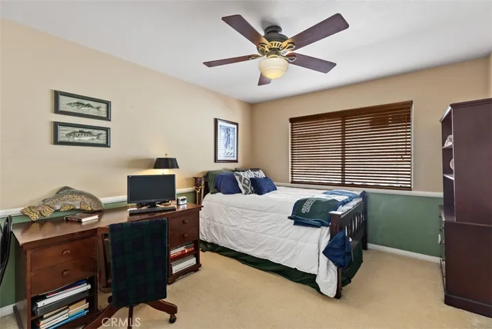 Spacious bedroom with room for chest and desk