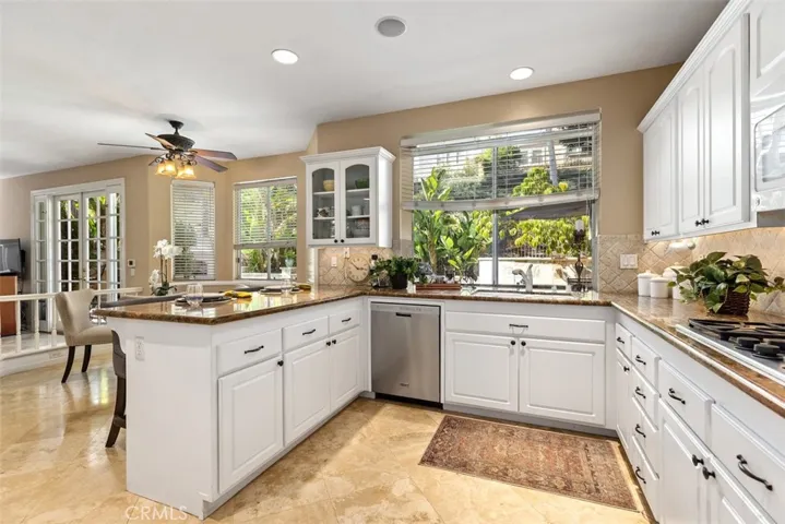 Kitchen opens to the family room and what a view to the beautiful back yard