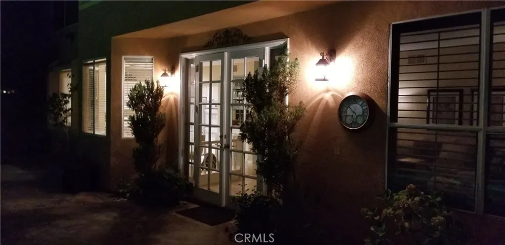 View of back of home at night