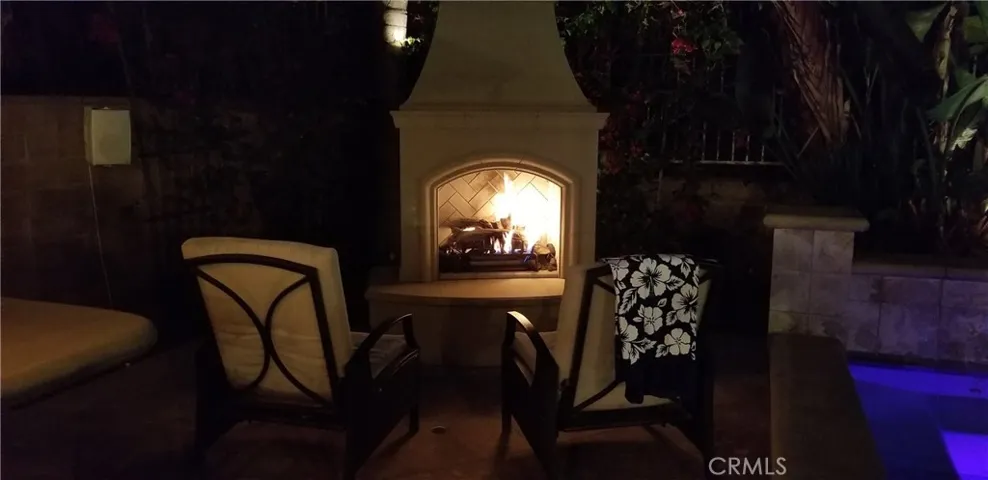 Relax by the custom fireplace at night