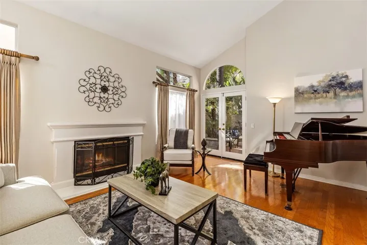 French Doors from the living room lead to a serene setting to relax by the fountain