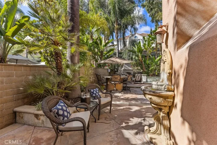 Side yard from living room leading to a resort style backyard
