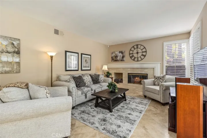 Family room with fireplace adjoins the kitchen