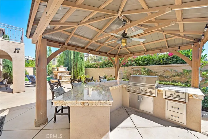 Covered bbq area with additional storage and gas cooktop