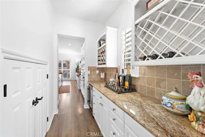 Butlers pantry with walk-in pantry